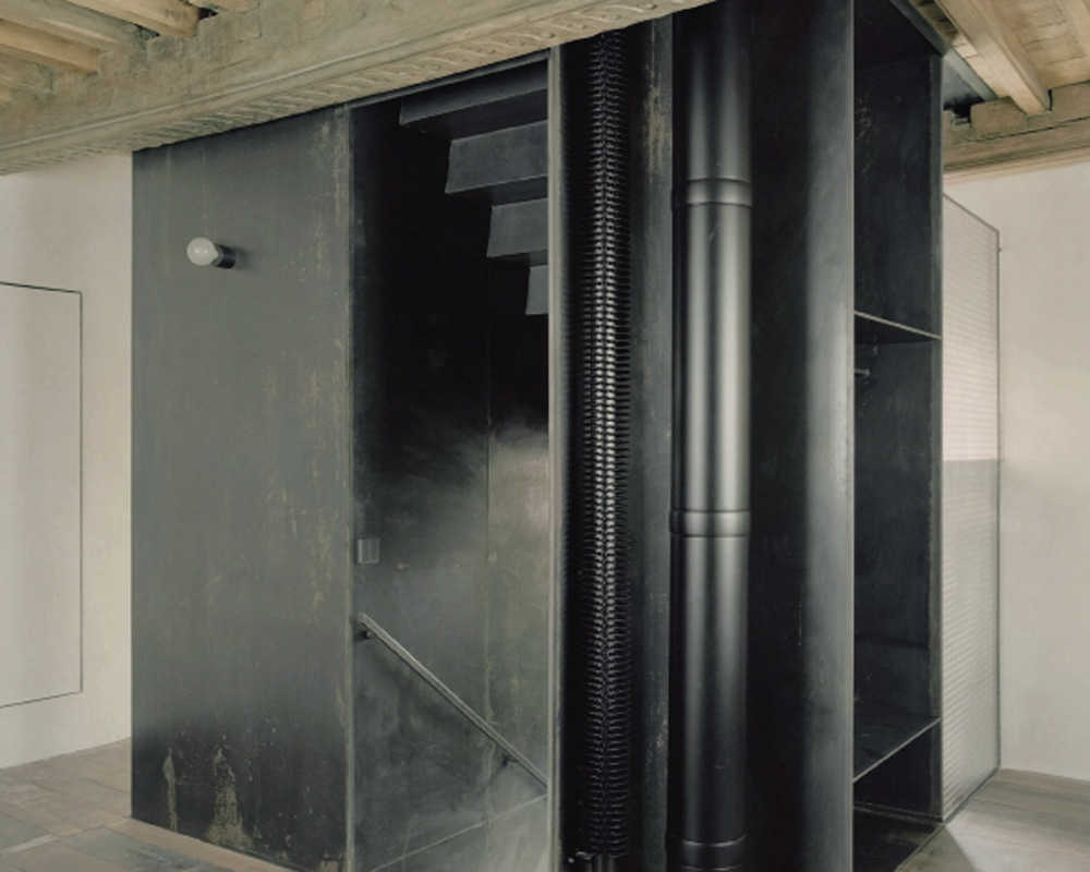 towertower: The insertion of a full metal tower within the tower allows for the integration of essential amenities.